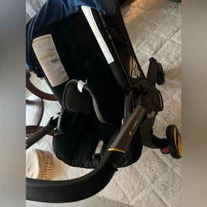 It’s a DOONA car seat, it’s used but in good condition